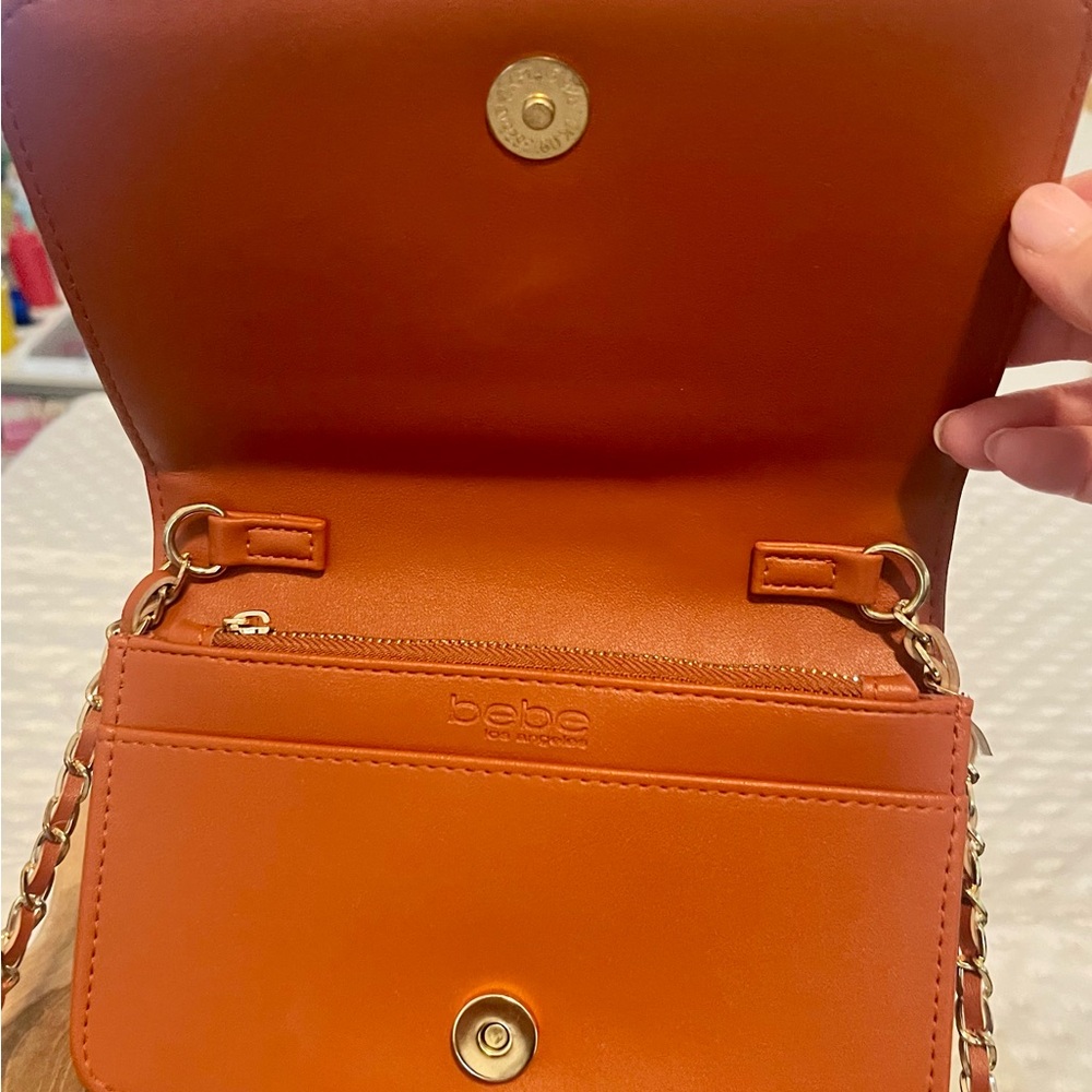 Elegant BEBE Sophia
Crossbody Bag Warm Blush
New condition - Picture 6 of 10